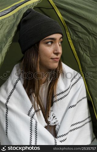woman camping looking away
