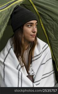 woman camping looking away