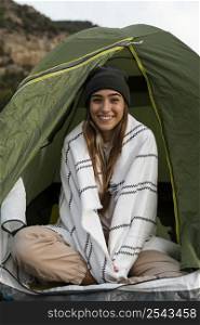 woman camping sitting tent