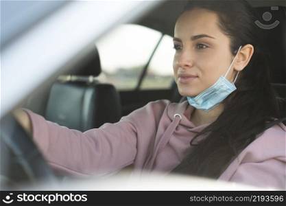 woman car use properly mask