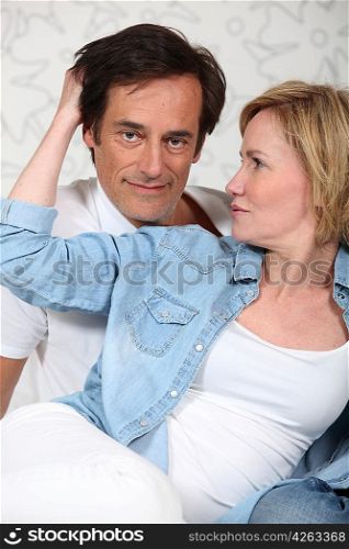 Woman caressing a man&acute;s hair