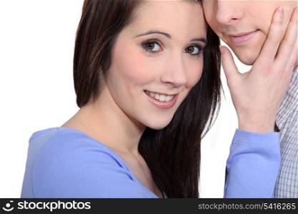 Woman caressing a man&rsquo;s face