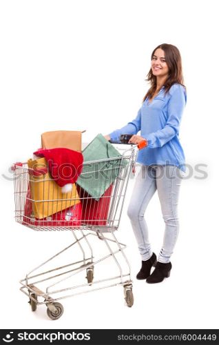 Woman carrying a shopping cart full of gifts