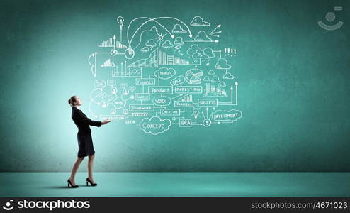 Woman carrying ideas. Young businesswoman carrying her great business plan in hands