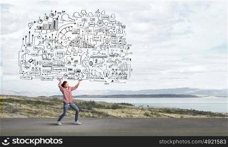 Woman carrying ideas. Young businesswoman carrying her great business plan in hands