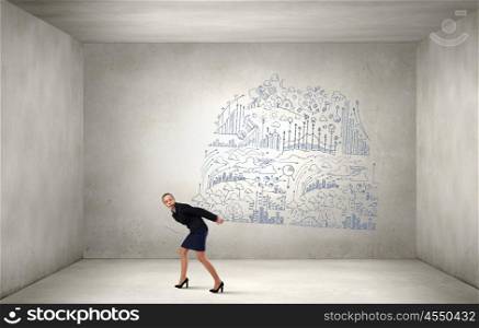 Woman carrying ideas. Young businesswoman carrying her great business plan on back