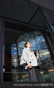 Woman Carrying Notebooks