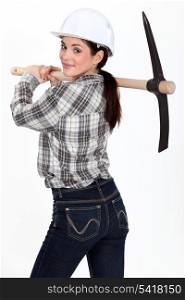 Woman carrying pick-axe