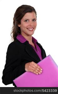 Woman carrying purple folder