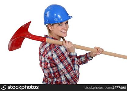 Woman carrying spade