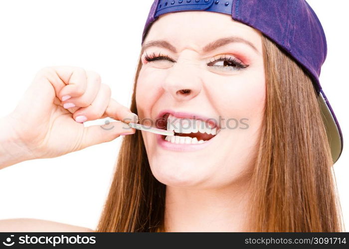 Woman casual style smiling teen girl holding a stick of chewing gum on white background. Youth style. Woman eating chewing gum