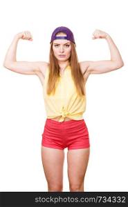 Woman casual style teen girl cap on head showing off muscles biceps. Youth style. Power and strength concept. Studio shot isolated on white. Woman casual style showing off muscles biceps
