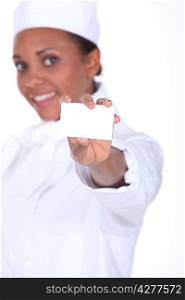 Woman caterer showing business card