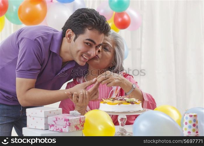 Woman celebrating birthday with grandson