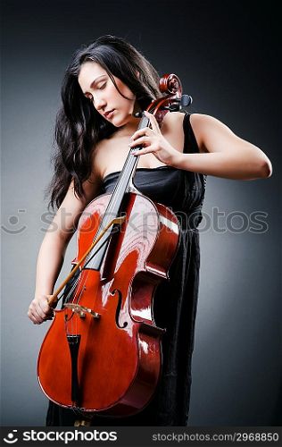 Woman cellist performing with cello