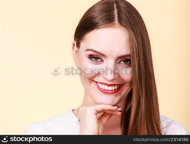 Woman charming girl looking at camera. Front portrait of the attractive thinking girl long hair over bright background.. Woman charming girl long hair looking at camera
