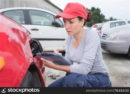 woman checking a car breakdown