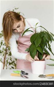 woman checking plant