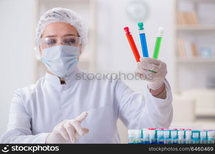 Woman chemist working in hospital clinic lab