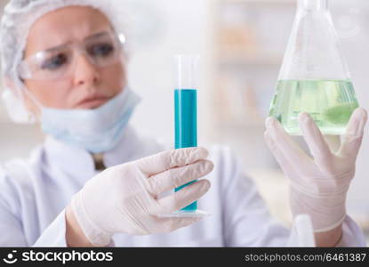 Woman chemist working in hospital clinic lab