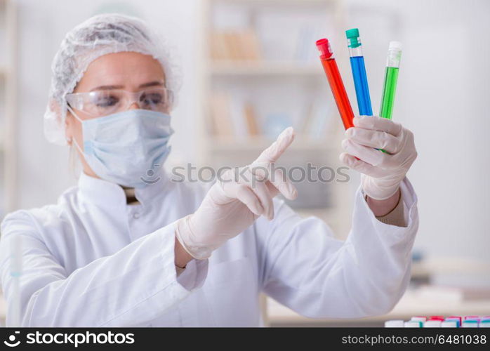 Woman chemist working in hospital clinic lab