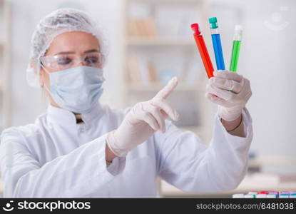 Woman chemist working in hospital clinic lab