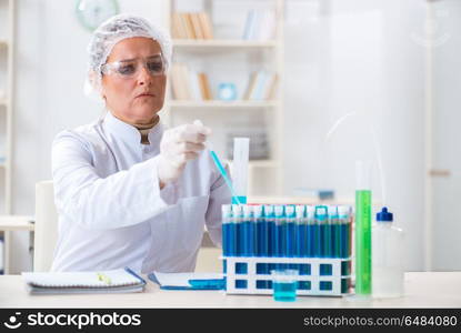 Woman chemist working in hospital clinic lab