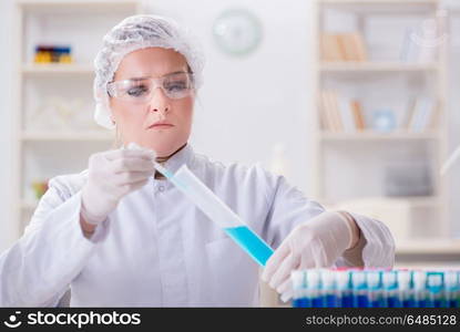 Woman chemist working in hospital clinic lab