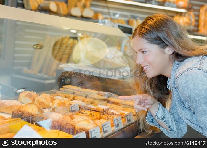 Woman choosing a patisserie