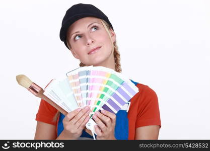 Woman choosing color on swatches