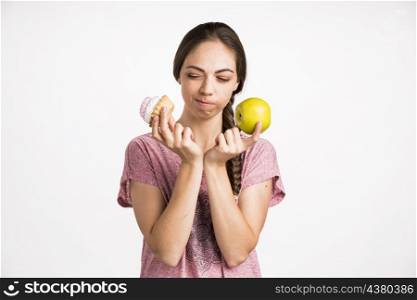 woman choosing cupcake apple