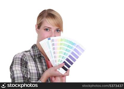 Woman choosing new color for house
