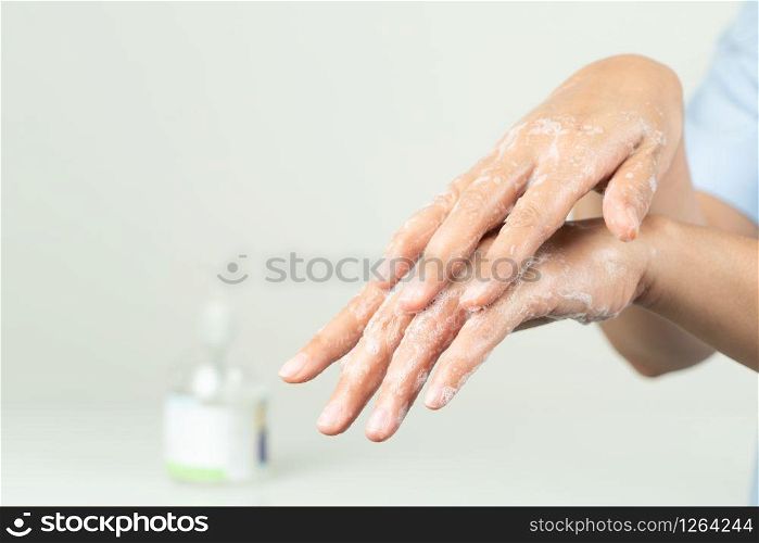 woman clean hand by anti bacteria soap to protect virus, germ, bacteria
