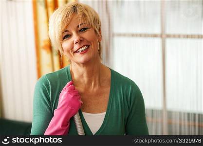 Woman cleaning and mopping the floor in her home