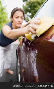 Woman cleaning car