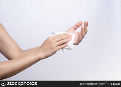Woman cleaning her hands with white soft tissue paper. isolated . Woman cleaning her hands with white soft tissue paper. isolated on a white backgrounds