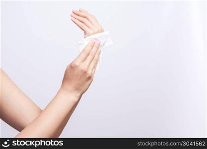 Woman cleaning her hands with white soft tissue paper. isolated . Woman cleaning her hands with white soft tissue paper. isolated on a white backgrounds