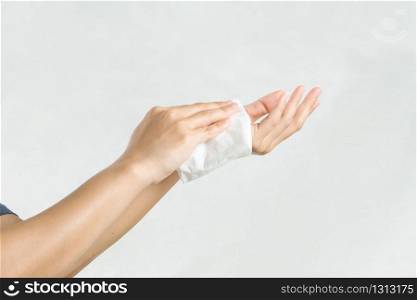 Woman cleaning her hands with white soft tissue paper. isolated on a white backgrounds