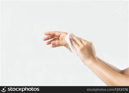 Woman cleaning her hands with white soft tissue paper. isolated on a white backgrounds