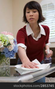 Woman cleaning table