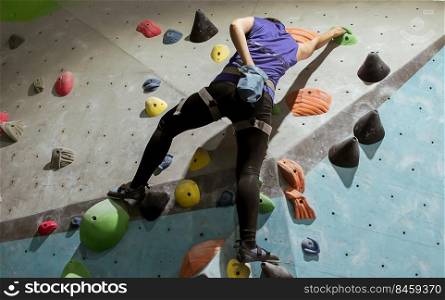 Woman climbing rock mountain for adventure and sport. Activity and Health Concept.