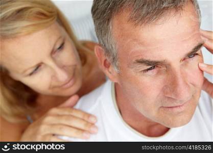 Woman comforting anxious husband