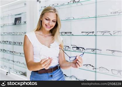 woman comparing glasses frames