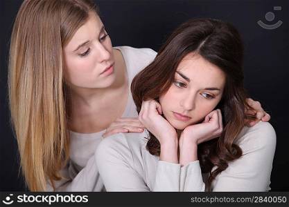 Woman consoling her friend