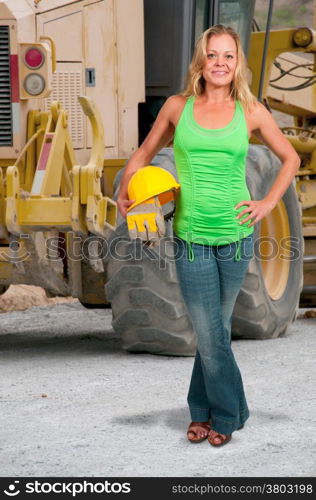 Woman construction worker with hard hat and work gloves