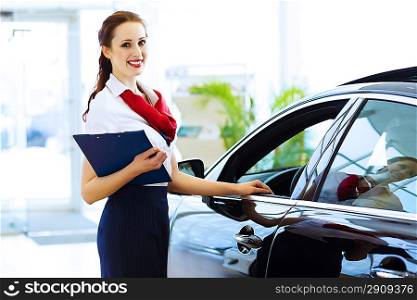 Woman consultant at car salon