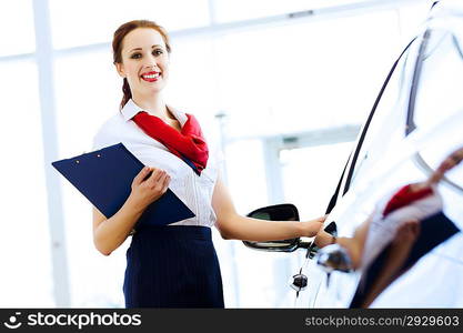 Woman consultant at car salon