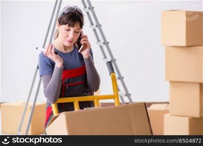 Woman contractor moving boxes in relocation concept