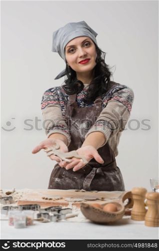 Woman cooking cookies or pie or cake