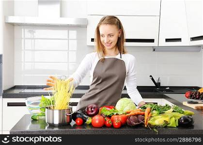 Woman cooking in modern kitchen